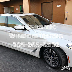 White BMW 5 Series with ceramic window tint Miami FL