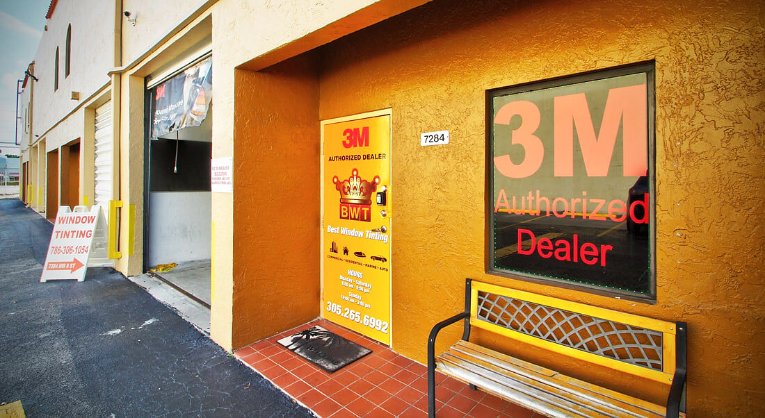 3M automotive window film sample displays on the shop wall