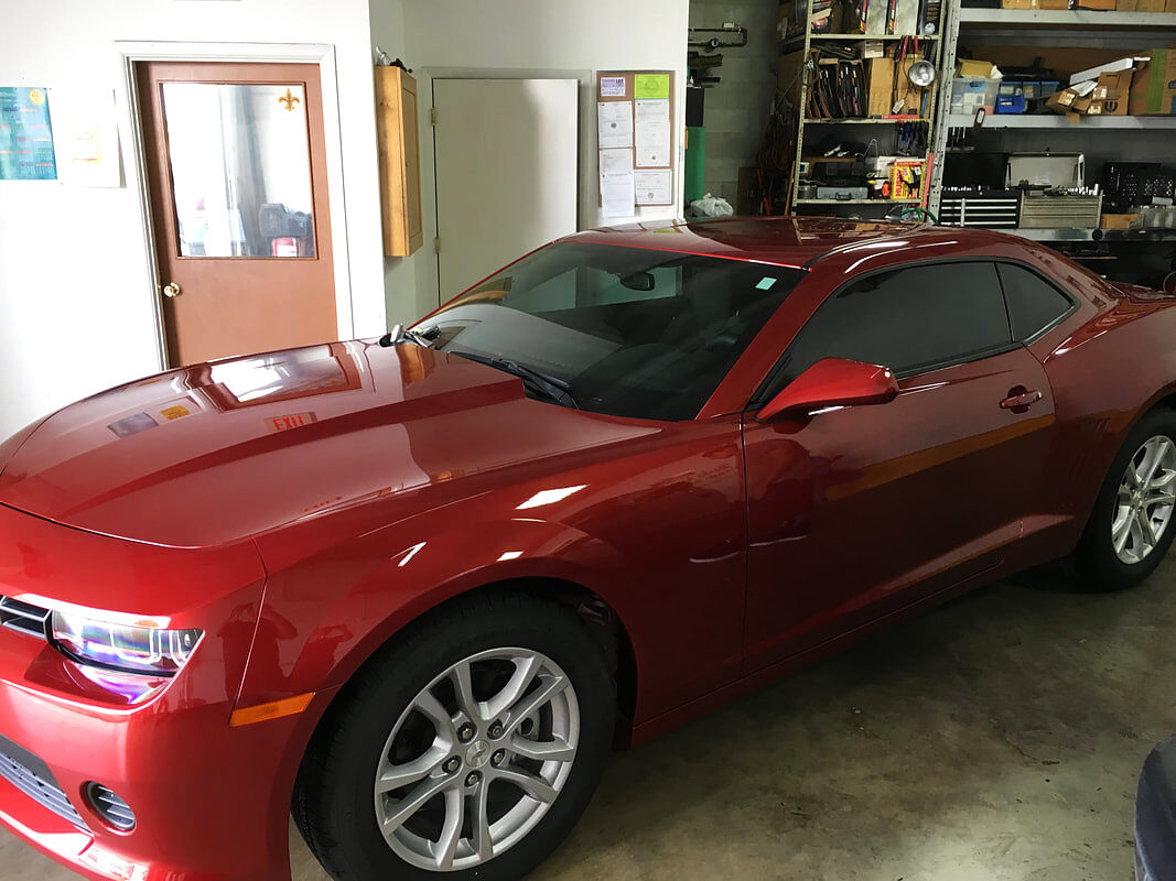 Red Chevrolet Camaro after window tinting in Miami